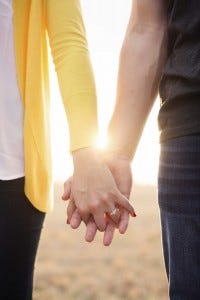 couple holding hands couple holding hands
