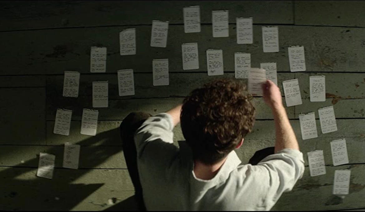 Jonathan (Andrew Garfield) assembling his notes