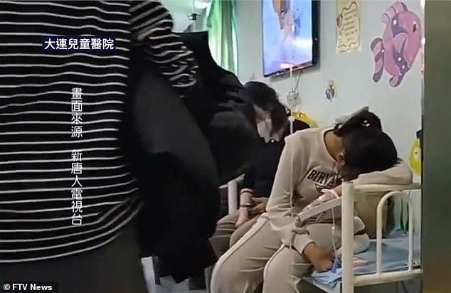A news clip taken from FTV News appears to show a busy hospital waiting room in China with children receiving intravenous drips