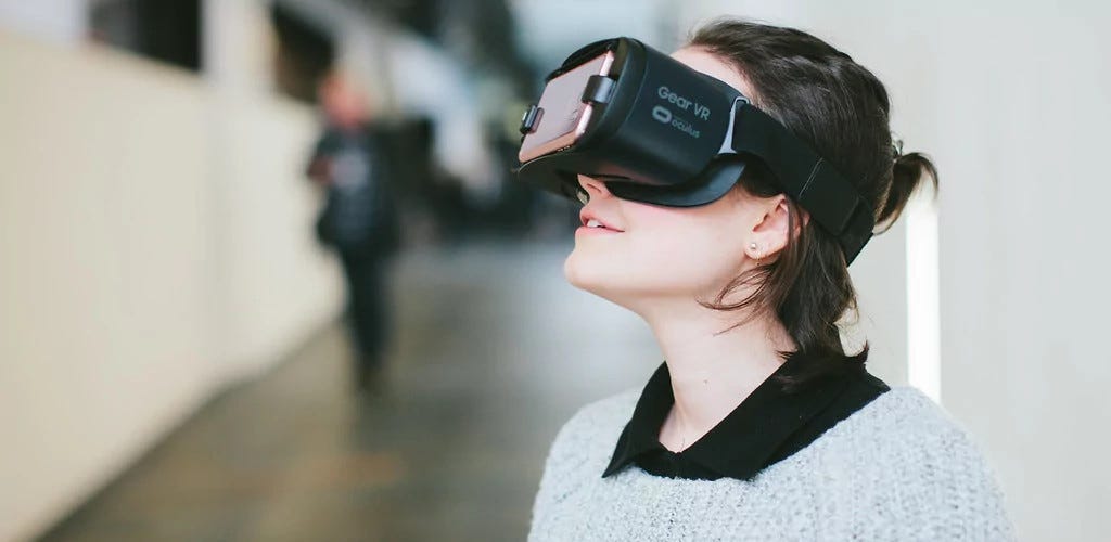 Woman engaging with a virtual reality headset.