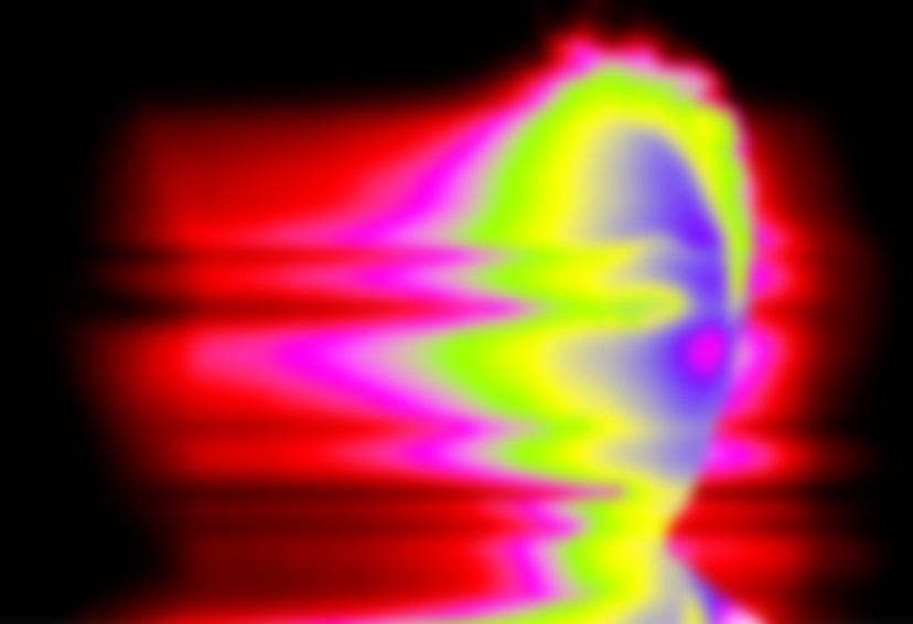 A blurry image of a flower with a black background A blurry image of a flower with a black background