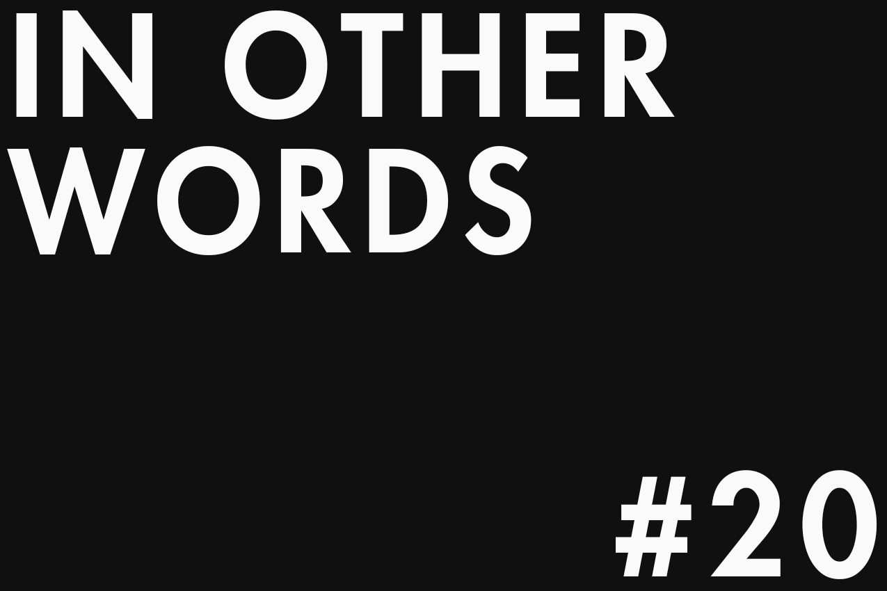 Minimalist typographic image featuring "IN OTHER WORDS" in the top-left corner and "#20" in the bottom-right one. The two elements are separated by negative space in a gallery-style layout. Part of the In Other Words series at The Subtext Review.