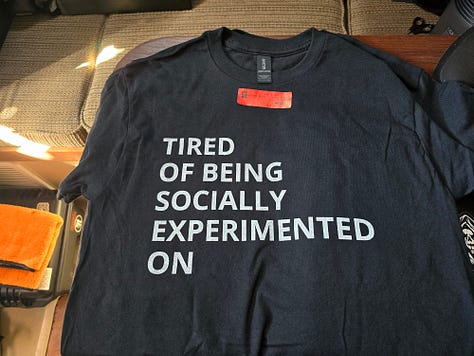 Images of three shirts; Faith over Fear, "I'm tired of being socially experimented on", and "there is no easy path from the Earth to the Stars"