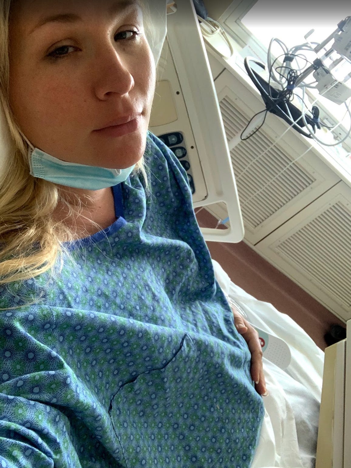 mother wearing a surgical mask hooked to hospital monitors during a magnesium drip for preeclampsia mother wearing a surgical mask hooked to hospital monitors during a magnesium drip for preeclampsia