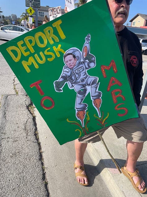 Protestors holding signs