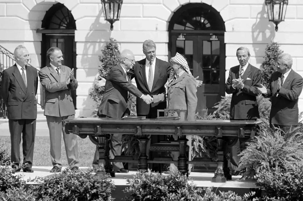 The famous handshake between Yitzhak Rabin and Yasir Arafat after signing the Oslo accords at the White House in 1993 was seen as a first step toward peace and Palestinian statehood. The famous handshake between Yitzhak Rabin and Yasir Arafat after signing the Oslo accords at the White House in 1993 was seen as a first step toward peace and Palestinian statehood.