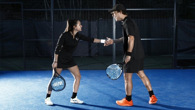padel players on a court