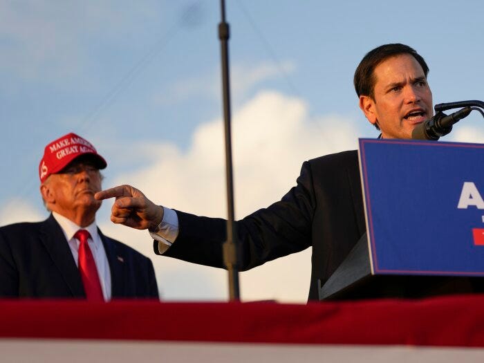 Sen. Marco Rubio, R-Fla., speaks as former President Donald Trump listens at a campaign rally at the Miami-Dade County Fair and Exposition on Sunday, Nov. 6, 2022, in Miami.