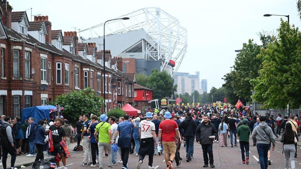 Fans walking to a footbal stadium