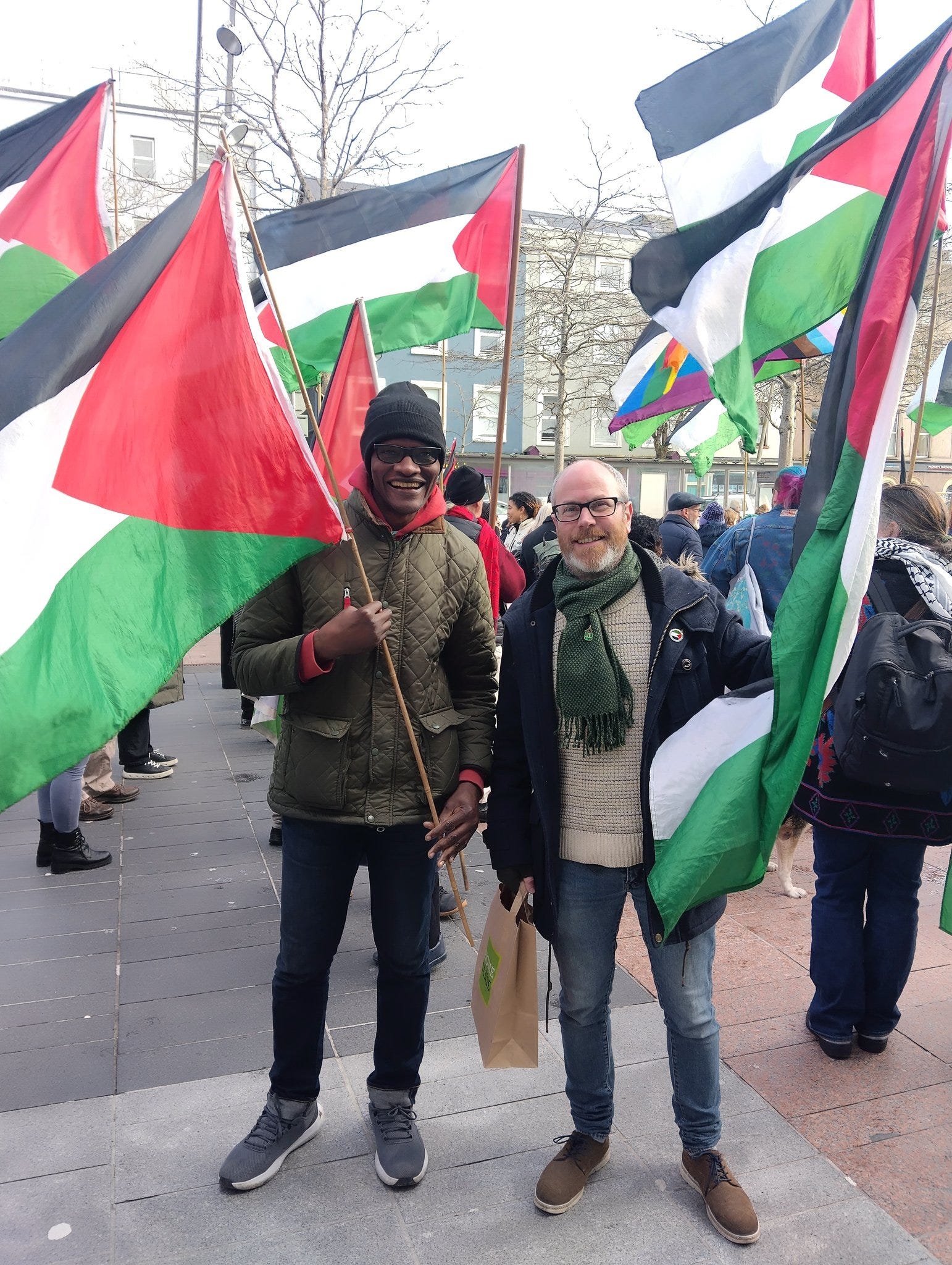 Oliver Moran with his Green Party colleague, Honoré Kamegni, at the weekly solidarity rally for peace in Palestine. Oliver Moran with his Green Party colleague, Honoré Kamegni, at the weekly solidarity rally for peace in Palestine.