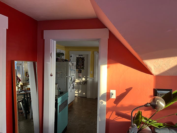 Image of two corners of a room where walls of different colors converge.