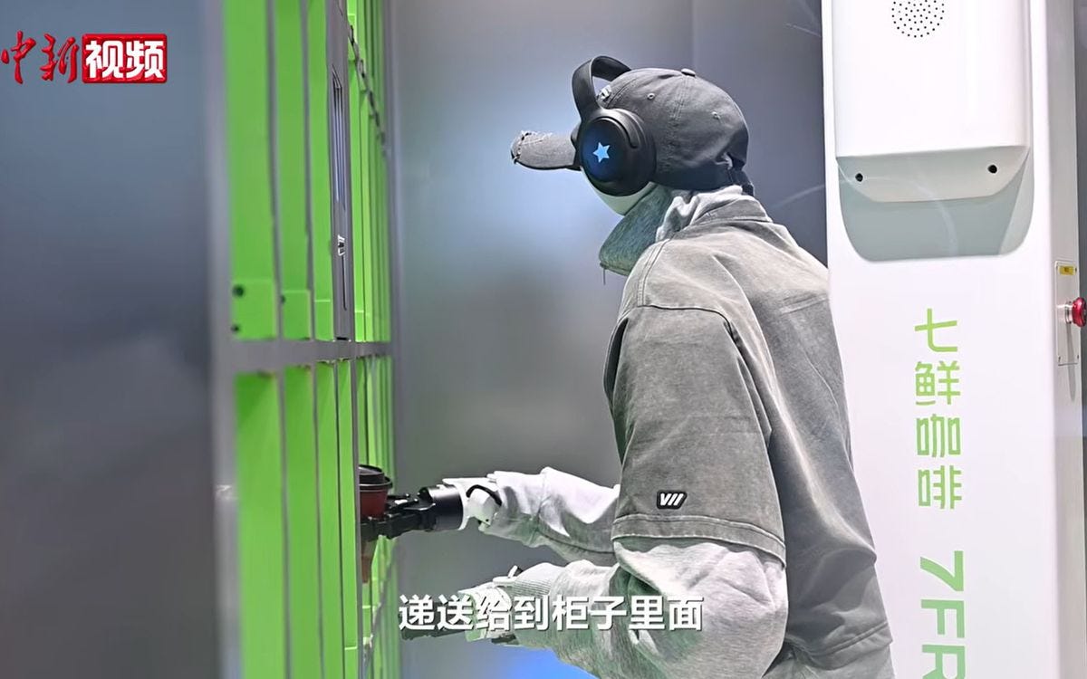 Barista-bot pops the coffee cup in a cute 'lil pigeon hole for the customer to collect