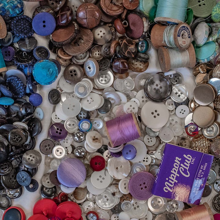 Colorful diptych of a pile of buttons on the left and an embroidered dress on the right.