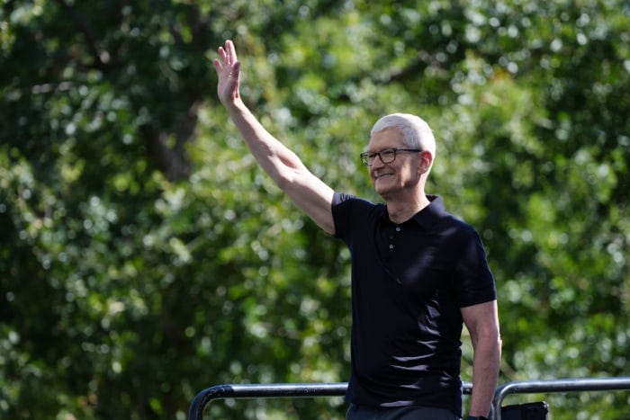 Tim Cook waving at Apple Worldwide Developers Conference (WWDC).
