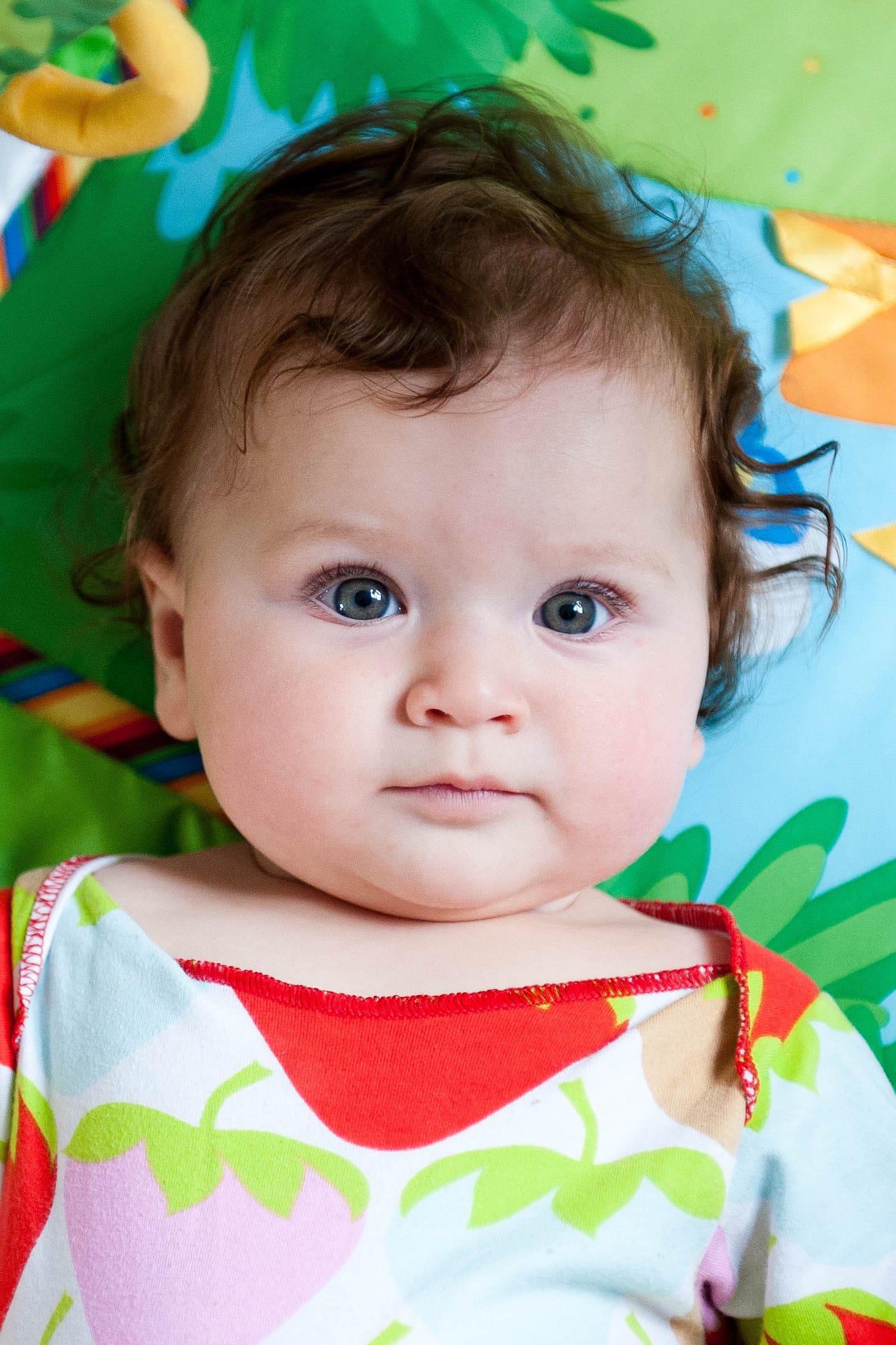 a baby on a play mat