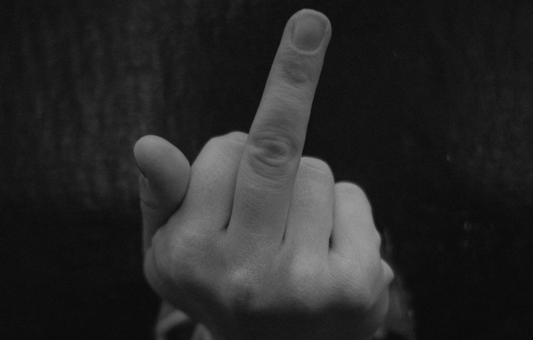 a person pointing a finger at the camera