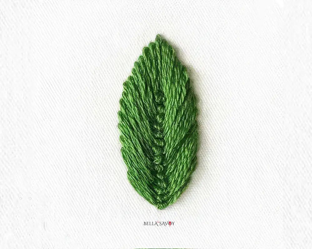 green leaf made of stacked fly stitches