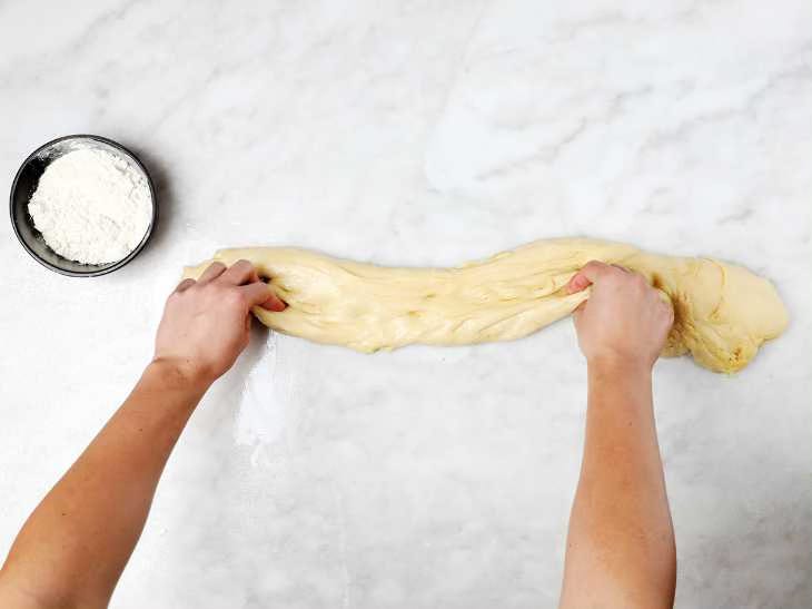 Stretching Dough on Pastry Table