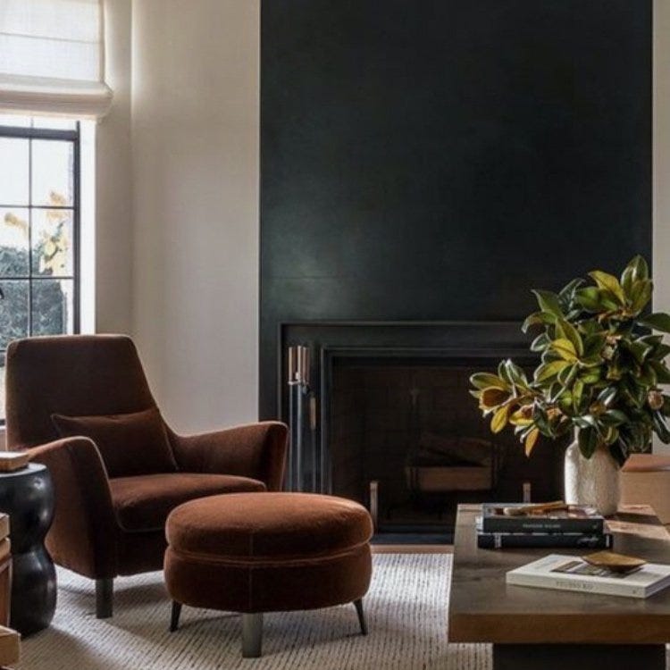 Room with a black accent wall.
