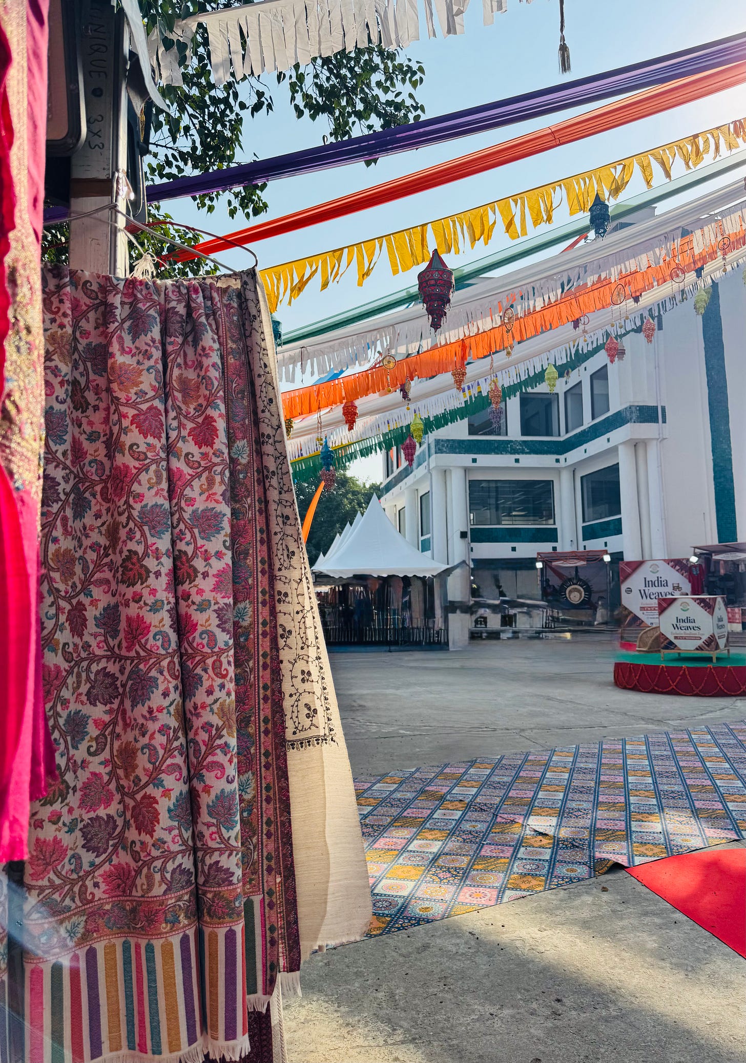 Colour woven shawls and scarves in a Delhi market Colour woven shawls and scarves in a Delhi market