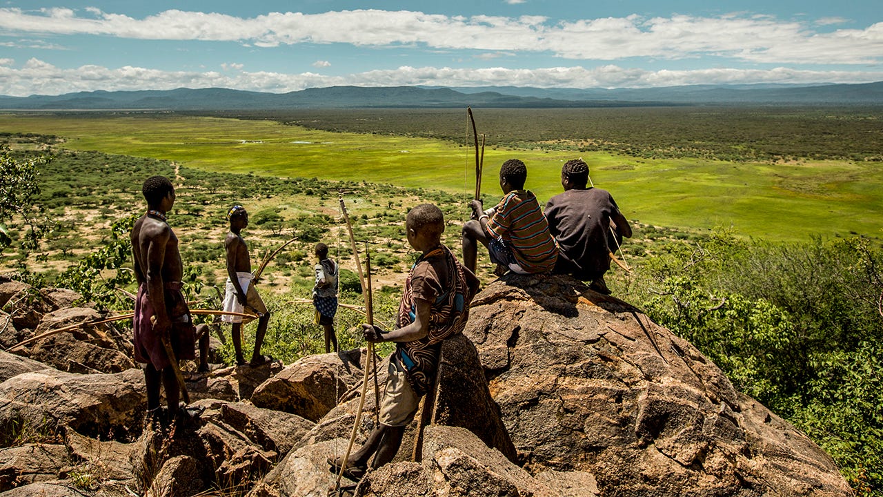 Hadza men hunt on a ridge above the Yaeda Valley in Tanzania.