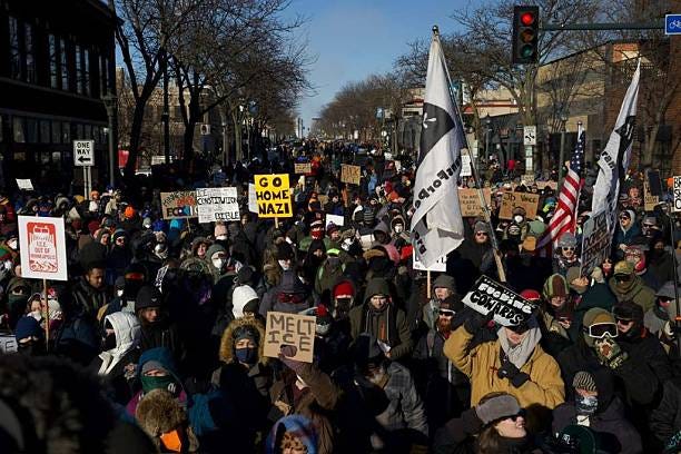Community members gather near the scene of the shooting and barricade the area after federal agents and state police leave in Minneapolis, United... Community members gather near the scene of the shooting and barricade the area after federal agents and state police leave in Minneapolis, United...