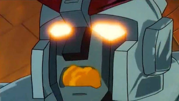 Autobot Prowl's face with yellow glowing eyes and smoke coming from his mouth right before he dies