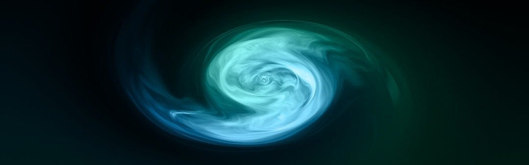 a green and blue swirl in the dark a green and blue swirl in the dark