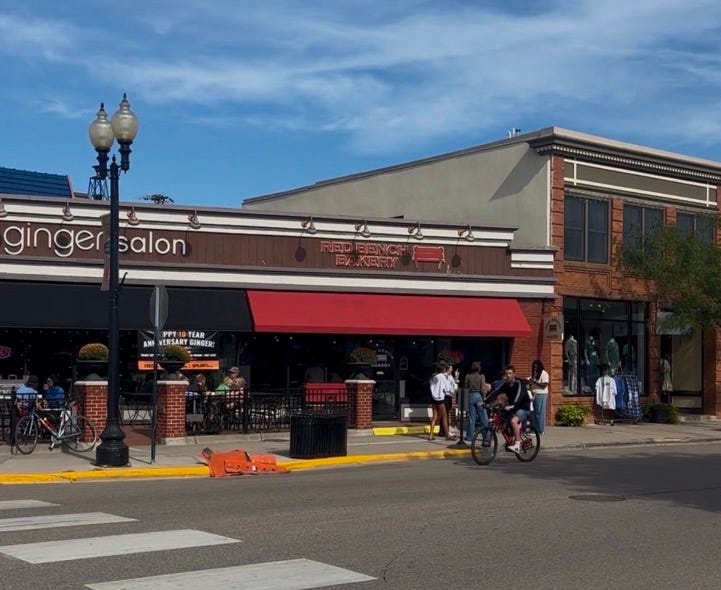 A street with a store front
Description automatically generated with medium confidence A street with a store front
Description automatically generated with medium confidence