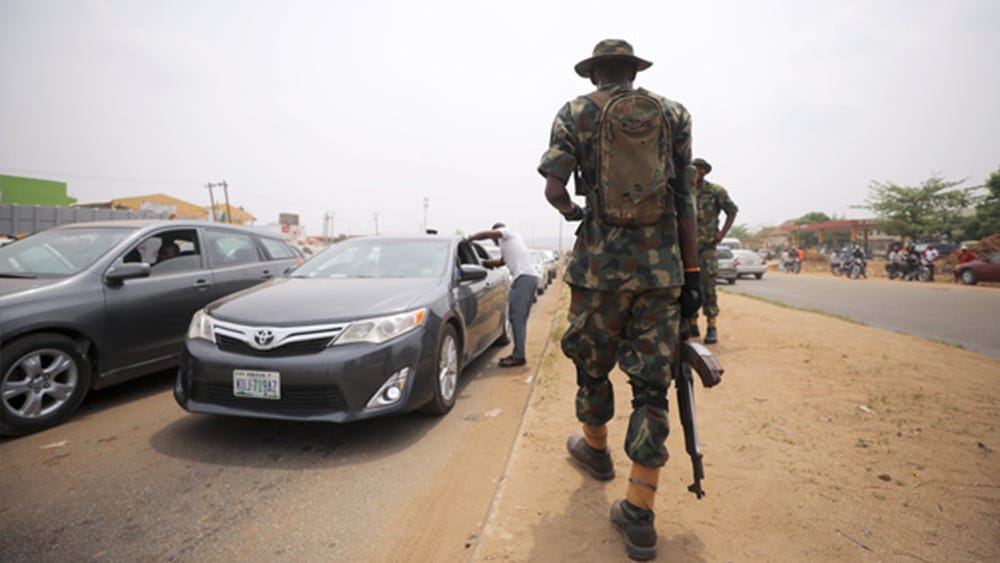 A soldier observes temperature checks at the border between Abuja and Nasarawa states in Nigeria, as the authorities try to limit the spread of the coronavirus disease (COVID-19), on March 30, 2020. Afolabi Sotunde/Reuters A soldier observes temperature checks at the border between Abuja and Nasarawa states in Nigeria, as the authorities try to limit the spread of the coronavirus disease (COVID-19), on March 30, 2020. Afolabi Sotunde/Reuters
