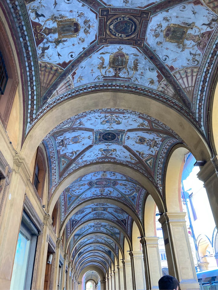 Portico ceiling and sunlight piazza in Bologna