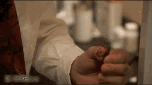 Nicholas Cage eating cockroach disgustedly.