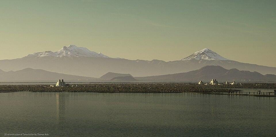 A body of water with mountains in the background
Description automatically generated