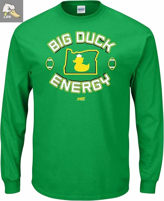 Green long-sleeve Oregon Ducks “Big Duck Energy” shirt with bold yellow duck logo inside Oregon state map outline, perfect for showing team spirit on game day. Deals on seats, fan gear, and premium content at www.Ducks4.Life