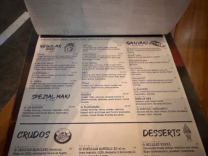 Sutorīto Māketto's menu comes in a clipboard. The focuses are sushi, snacks, and rice bowls and noodles