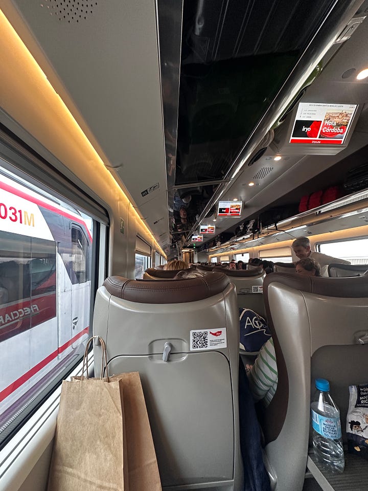 A picture of a red iryo train and a picture of what it looks like inside