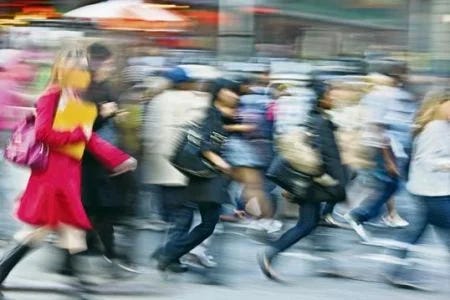 A group of people crossing the street

AI-generated content may be incorrect.
