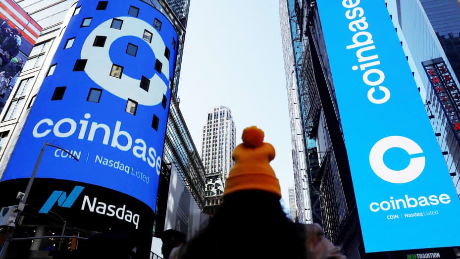The logo for Coinbase Global Inc, the biggest U.S. cryptocurrency exchange, is displayed on the Nasdaq MarketSite jumbotron and others at Times Square in New York, U.S., April 14, 2021.