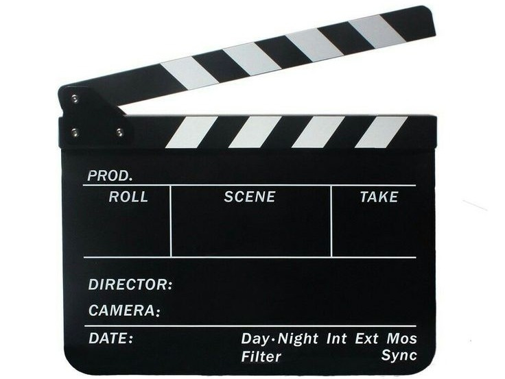 This may contain: a movie clapper sitting on top of a white surface