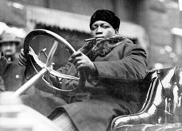 Heavyweight champion Jack Johnson, circa 1910. When a Southern town charged  him a then ridiculously expensive $50 for speeding, he peeled off a $100  bill from his bankroll and said "Keep it.