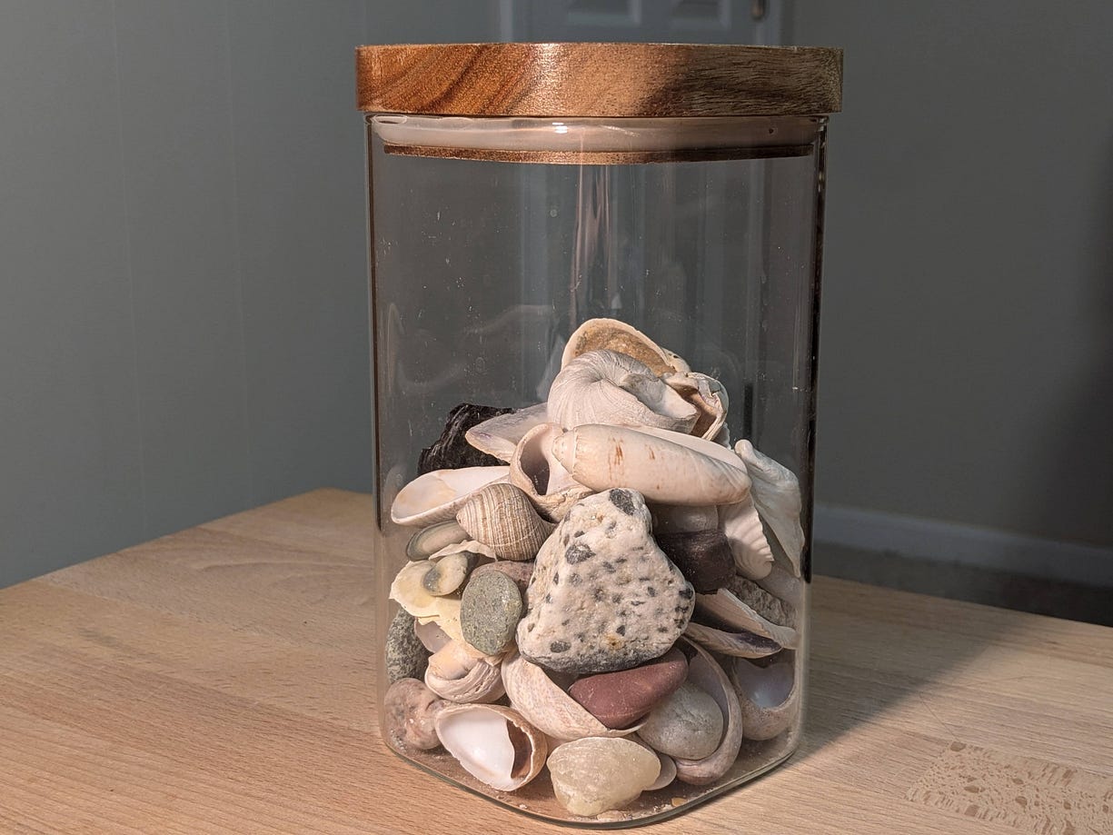 Image of a glass jar full of seashells