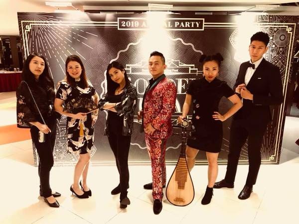 My colleagues and I looking sharp at the party
