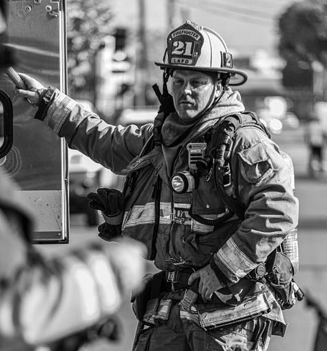 images of firemen working a fire in downtown LA's produce district