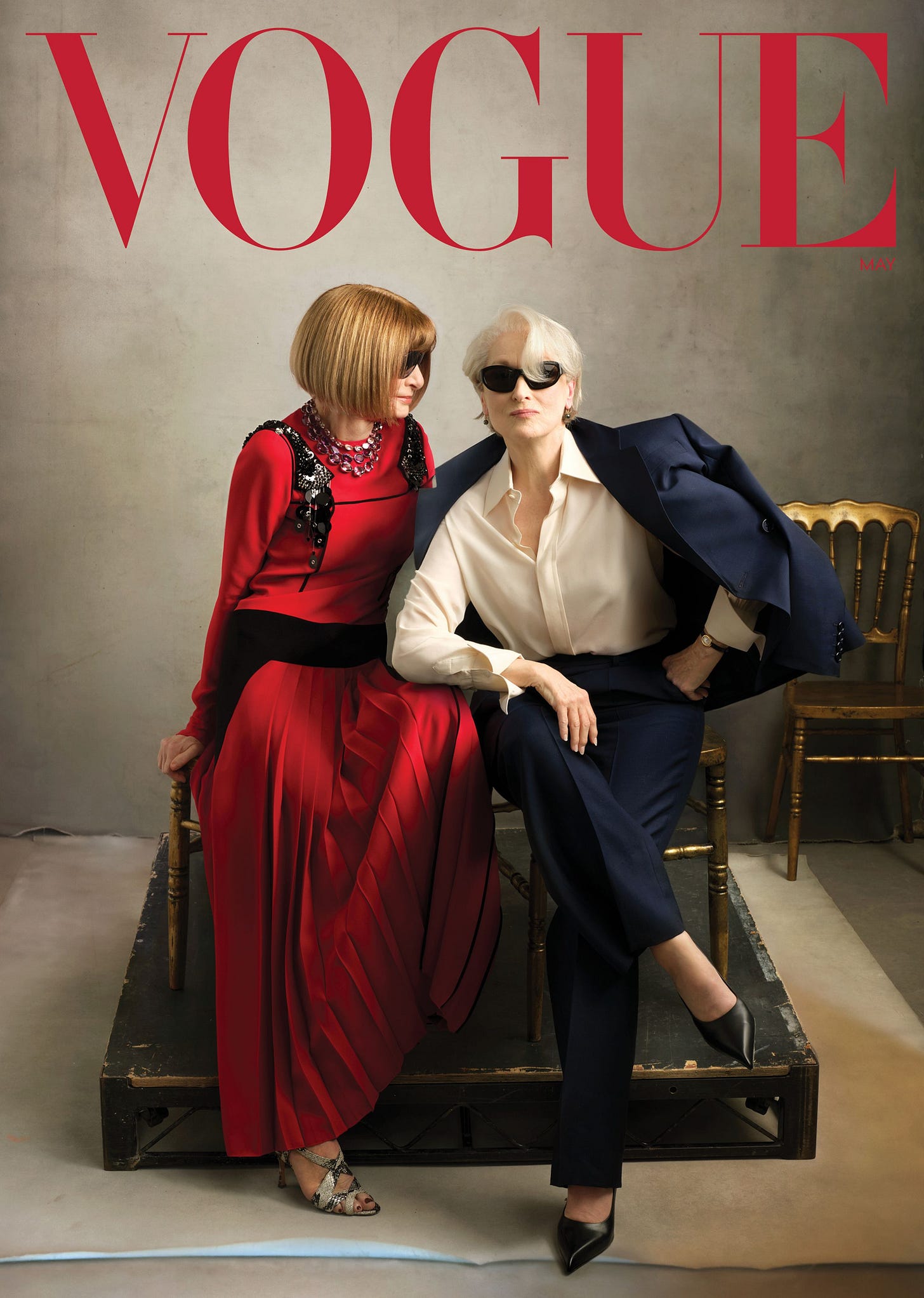 Image may contain Meryl Streep Anna Wintour Publication Adult Person Clothing Coat Dress Formal Wear and Book