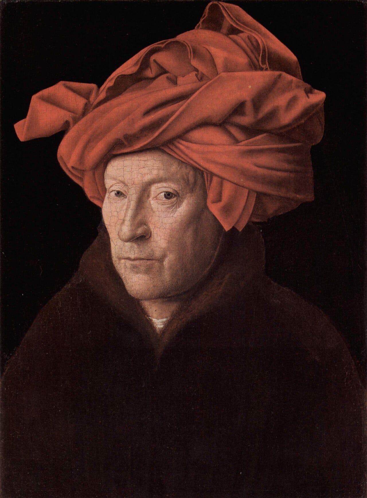 Man in folded red headdress