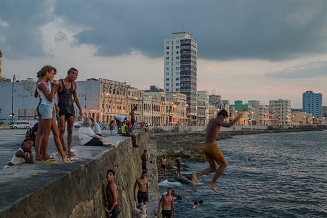 A second 3x3 grid of nine photographs from Havana, Cuba. The images show daily city life, including: kids jumping off the Malecón sea wall, people fishing at sunset, boys playing soccer in the street, classic American cars, a mural of Che Guevara, a dilapidated building, and a street vendor with a fruit cart.