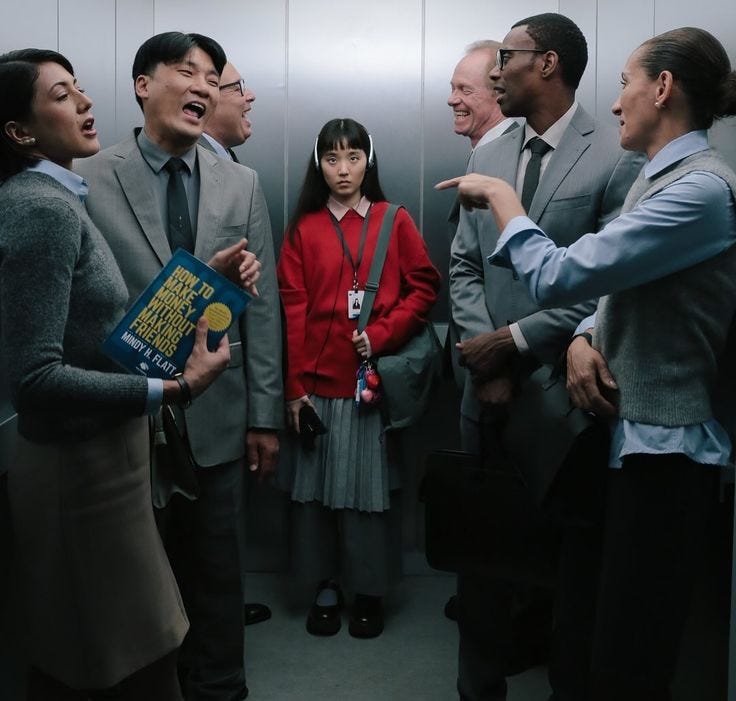 This may contain: a group of people standing around each other in a room with elevator doors and mirrors