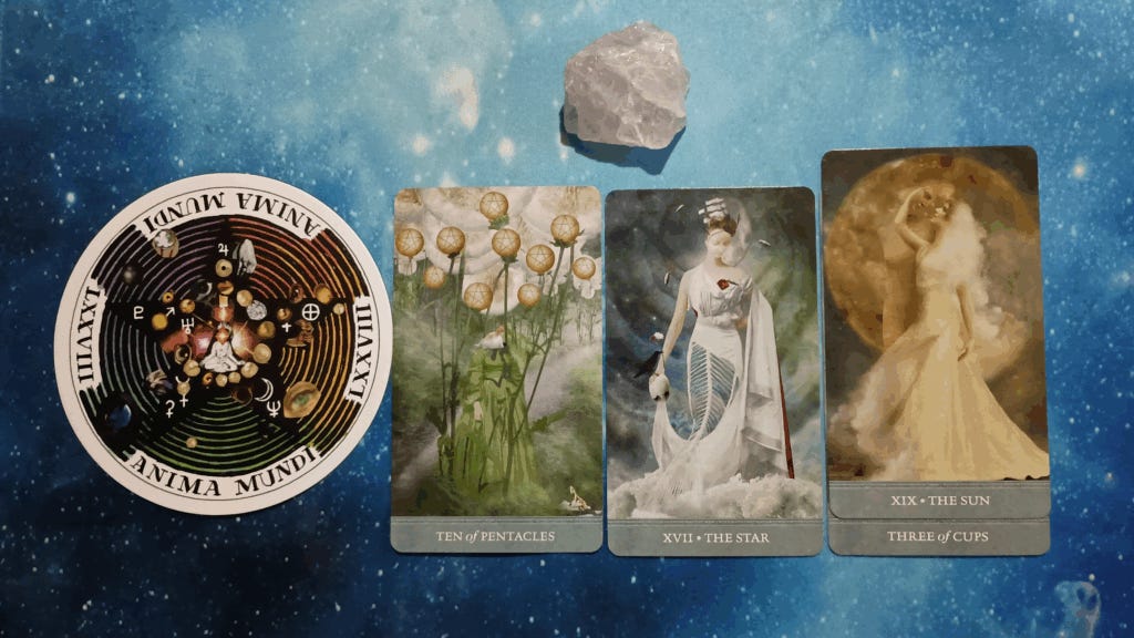 Alt txt: New Moon Pick-a-Card Tarot Reading for June 2025, pile 1 - rose quartz (pink) stone and 4 cards on a starry blue background
