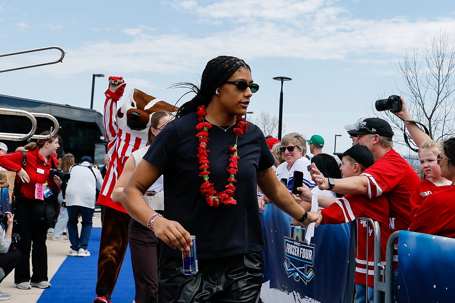 Wisconsin women's hockey alternate captain Laila Edwards wearing leather pants, a black shirt, and floral necklace