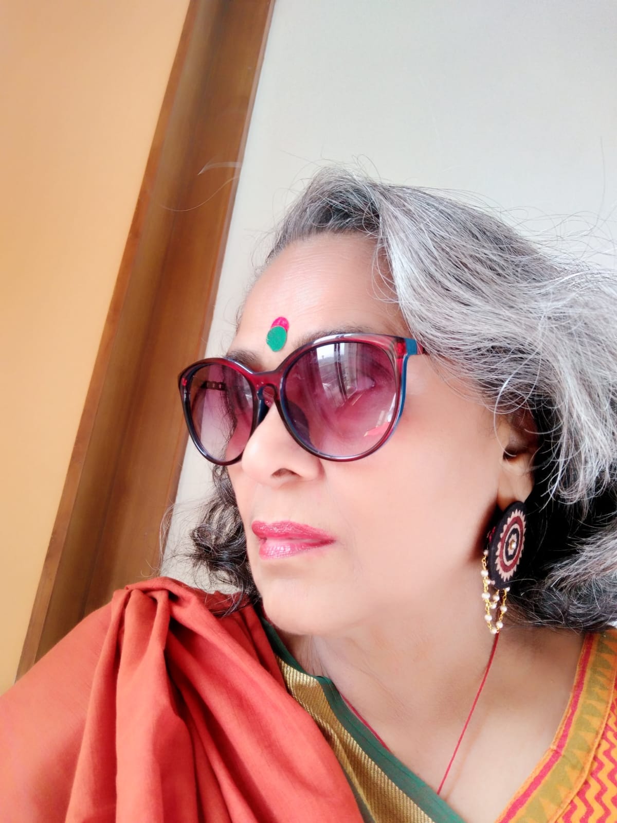 Photo of Margie flaunting her signature style - with a double Bindi, glares, sari and jewellery